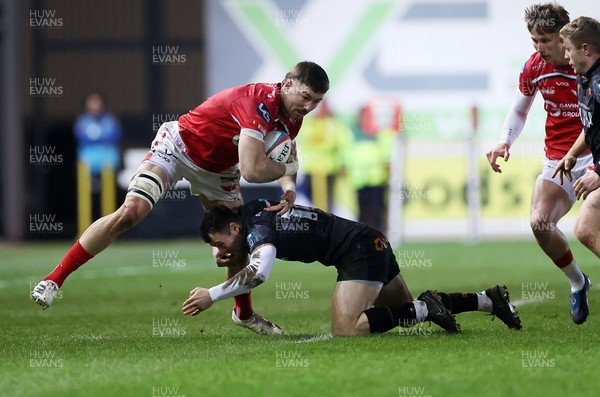 261225 - Scarlets v Ospreys - United Rugby Championship - Max Douglas of Scarlets is tackled by Ryan Conbeer of Ospreys 