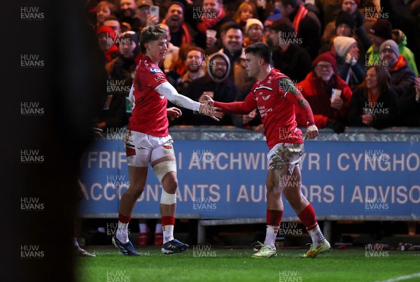261225 - Scarlets v Ospreys - United Rugby Championship - Joe Roberts of Scarlets celebrates scoring a try with Ellis Mee