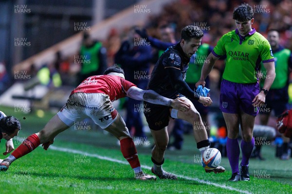 261225 - Scarlets v Ospreys - United Rugby Championship - Kieran Hardy of Ospreys kicks the ball through