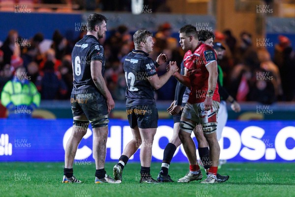 261225 - Scarlets v Ospreys - United Rugby Championship - Keiran Williams of Ospreys and Jarrod Taylor of Scarlets at the end of the match