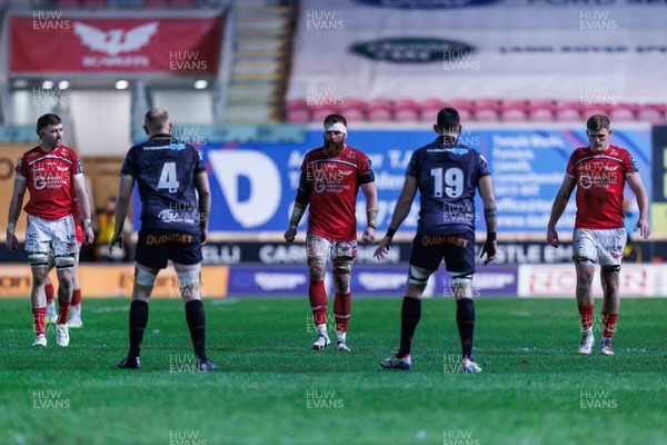 261225 - Scarlets v Ospreys - United Rugby Championship - (L to R) Scarlets players Max Douglas, Jake Ball and Taine Plumtree