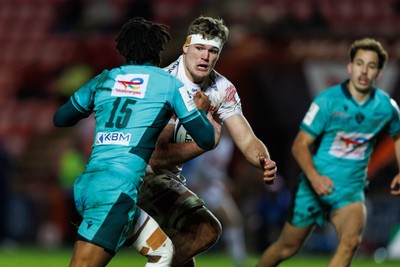 100126 - Scarlets v Section Paloise - Investec Champions Cup - Taine Plumtree of Scarlets takes on Theo Attissogbe of Pau on the way to scoring a try