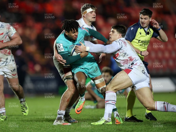 100126 - Scarlets v Section Paloise - Investec Champions Cup - Theo Attissogbe of Pau is tackled by Joe Hawkins of Scarlets 