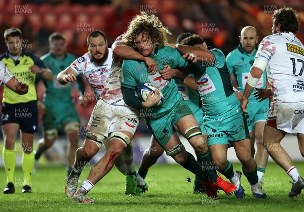 100126 - Scarlets v Section Paloise - Investec Champions Cup - Thomas Jolmes of Pau is tackled by Taine Plumtree of Scarlets 