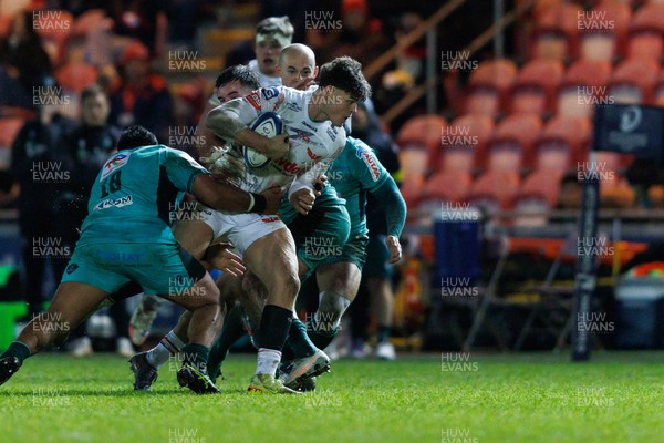 100126 - Scarlets v Section Paloise - Investec Champions Cup - Eddie James of Scarlets is tackled by Siate Tokolahi of Pau