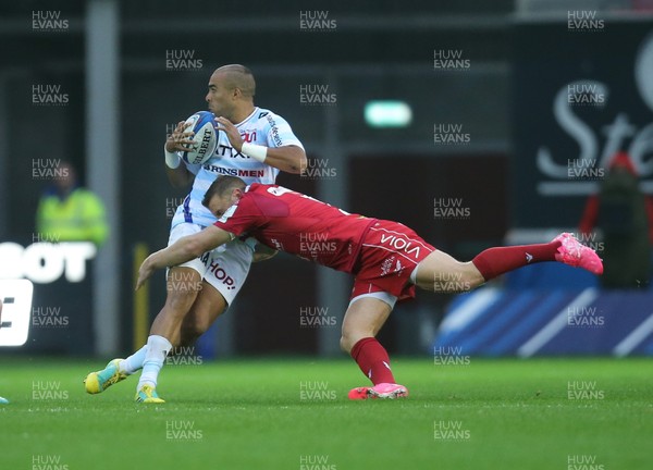 131018 - Scarlets v Racing 92, Champions Cup - Simon Zebo of Racing 92 is tackled by Hadleigh Parkes of Scarlets