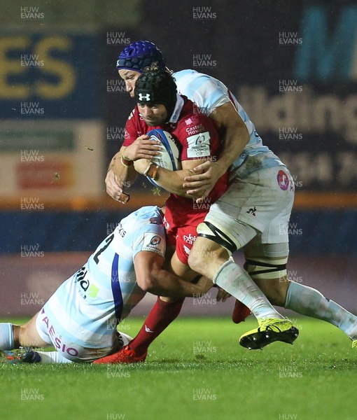 131018 - Scarlets v Racing 92, Champions Cup - Leigh Halfpenny of Scarlets is tackled by the Racing 92 defence