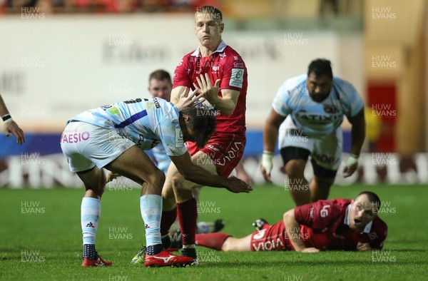 131018 - Scarlets v Racing 92, Champions Cup - Johnny McNicholl of Scarlets is tackled by Ben Volavola of Racing 92