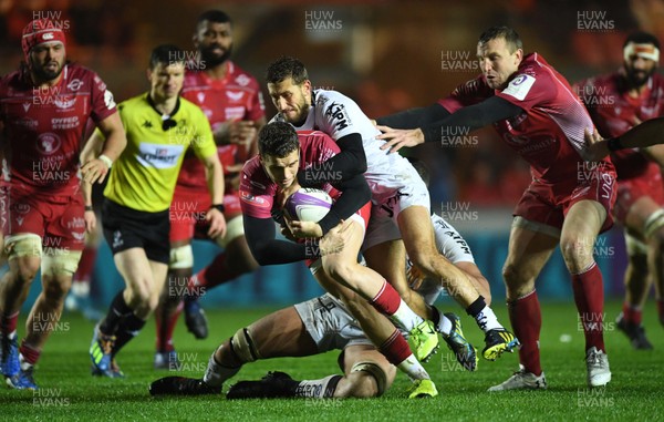 110120 - Scarlets v Toulon - European Rugby Challenge Cup - Kieran Hardy of Scarlets is tackled by Yoann Cottin and Swan Rebbadj of Toloun