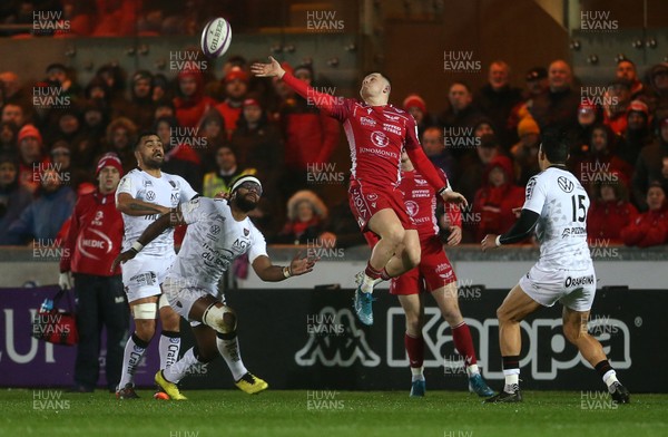 110120 - Scarlets v RC Toloun - European Rugby Challenge Cup - Steff Evans of Scarlets reaches for the ball