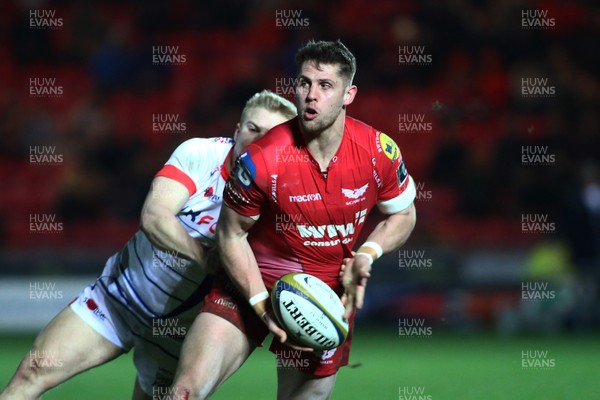 020218 Scarlets v Sale Sharks - Anglo-Welsh Cup -  Tom Williams of Scarlets is tackled by Aaron Reed of Sale Sharks 