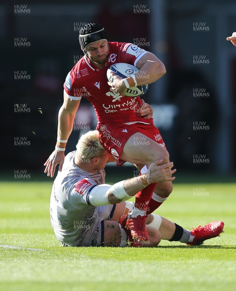 040421 Scarlets v Sale Sharks, European Champions Cup - Leigh Halfpenny of Scarlets is tackled by Jean-Luc du Preez of Sale Sharks