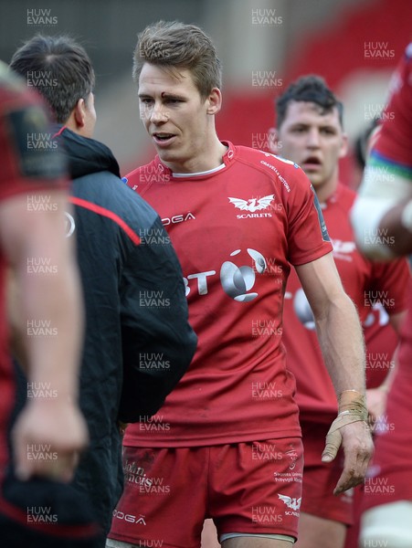 150117 Scarlets v Saracens - Champions Cup - Liam Williams of Scarlets with one of the Saracens staff after the final whistle  by Gwenno Davies/Huw Evans Agency