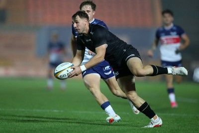 180926 - Scarlets v Saracens - Preseason Friendly - Tobias Elliott of Saracens under pressure from Macs Page of Scarlets