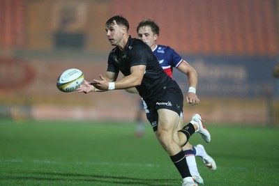180926 - Scarlets v Saracens - Preseason Friendly -  Tobias Elliott of Saracens under pressure from Macs Page of Scarlets 