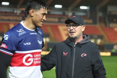 180926 - Scarlets v Saracens - Preseason Friendly - Dai Flanagan Saracens skills coach with Sam Lousi of Scarlets at the final whistle