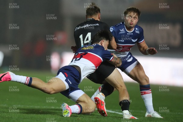 180926 - Scarlets v Saracens - Preseason Friendly - Joe Roberts of Scarlets tackles Tobias Elliott of Saracens with Macs Page of Scarlets in support