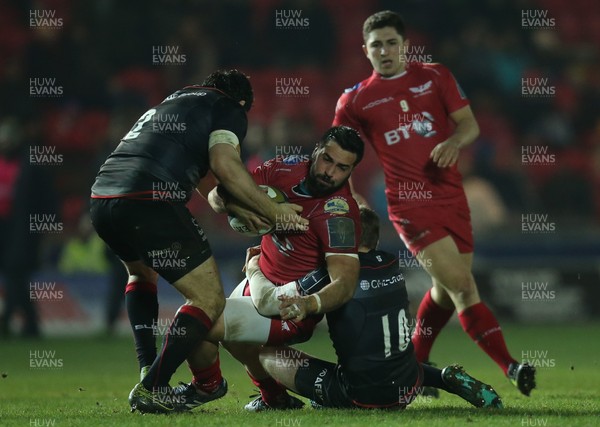 270117 - Scarlets v Saracens, Anglo Welsh Cup - Gareth Owen of Scarlets is tackled by Scott Spurling of Saracens and Rotimi Segun of Saracens