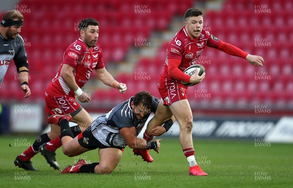 230220 - Scarlets v Isuzu Southern Kings - Guinness PRO14 - Steff Evans of Scarlets is tackled by Jerry Sexton of Southern Kings