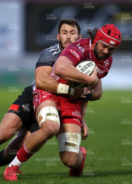230220 - Scarlets v Isuzu Southern Kings - Guinness PRO14 - Josh Macleod of Scarlets is tackled by Erich Cronje of Southern Kings