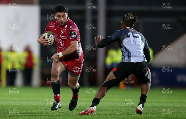 230220 - Scarlets v Isuzu Southern Kings - Guinness PRO14 - Kieron Fonotia of Scarlets is challenged by Howard Mnisi of Southern Kings