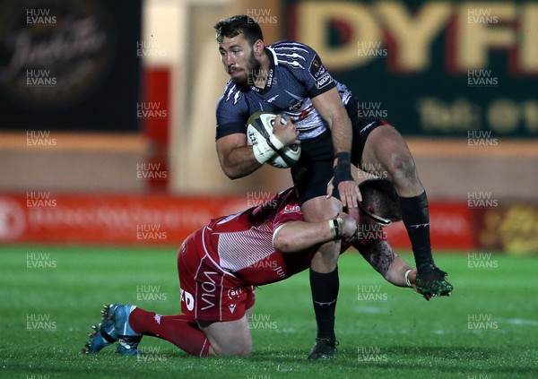 230220 - Scarlets v Isuzu Southern Kings - Guinness PRO14 - Erich Cronje of Southern Kings is tackled by Phil Price of Scarlets