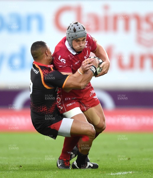 290918 - Scarlets v Southern Kings - Guinness PRO14 - Jonathan Davies of Scarlets is tackled by Golden Masimla of Southern Kings