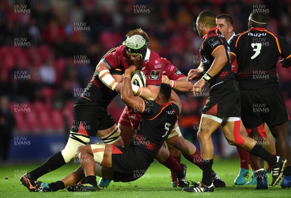 290918 - Scarlets v Southern Kings - Guinness PRO14 - Jake Ball of Scarlets is tackled by Bobby de Wee and JC Astle of Southern Kings