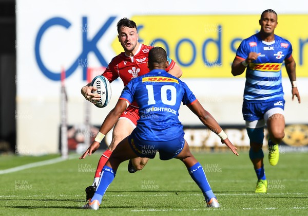 210522 - Scarlets v Stormers - United Rugby Championship - Ryan Conbeer of Scarlets is tackled by Manie Libbok