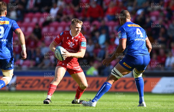 210522 - Scarlets v Stormers - United Rugby Championship - Sam Costelow of Scarlets takes on Salmaan Moerat of Stormers