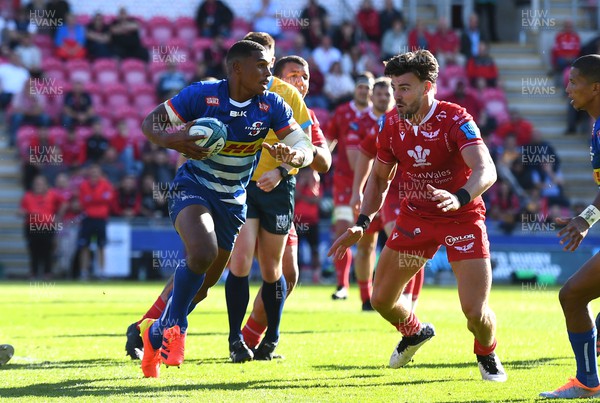 210522 - Scarlets v Stormers - United Rugby Championship - Damian Willemse of Stormers is tackled by Johnny Williams of Scarlets