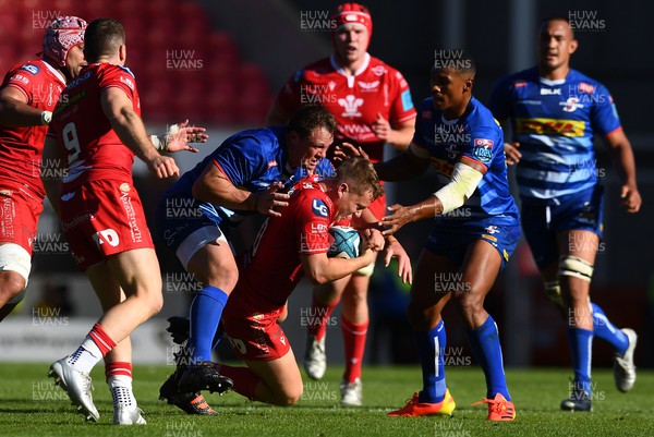 210522 - Scarlets v Stormers - United Rugby Championship - Sam Costelow of Scarlets is stopped
