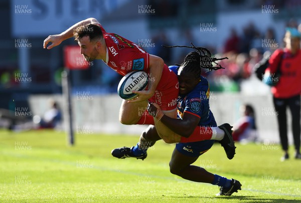 210522 - Scarlets v Stormers - United Rugby Championship - Ryan Conbeer of Scarlets is tackled by Seabelo Senatla of Stormers