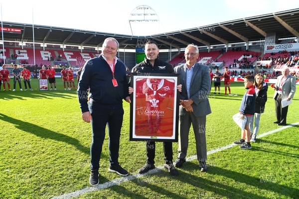 210522 - Scarlets v Stormers - United Rugby Championship - Rob Evans is presented with a jersey bySimon Muderack and Roy Bergiers after announcing he is leaving the club