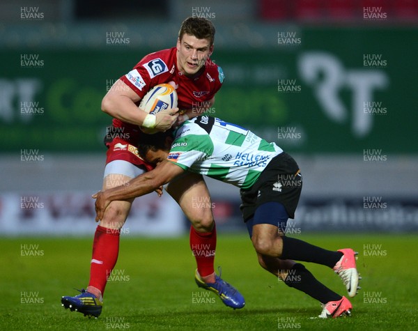 030513 - Scarlets v Treviso - RaboDirect PRO12 -Scott Williams of Scarlets is tackled by Brendan Williams of Benetton Treviso 