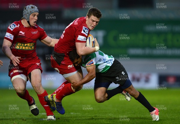 030513 - Scarlets v Treviso - RaboDirect PRO12 -Scott Williams of Scarlets is tackled by Brendan Williams of Benetton Treviso 