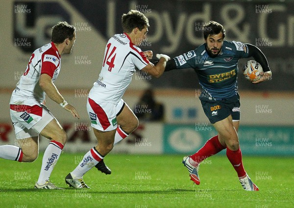 021113  - Scarlets v Ulster - RaboDirect PRO12 -  Ulster's Andrew Trimble tackles Scarlets Nic Reynolds