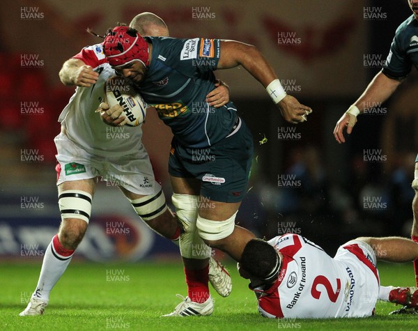 021113  - Scarlets v Ulster - RaboDirect PRO12 - Scarlets Sione Timani is tackled by Ulster's Rob Herring and Lewis Stevenson