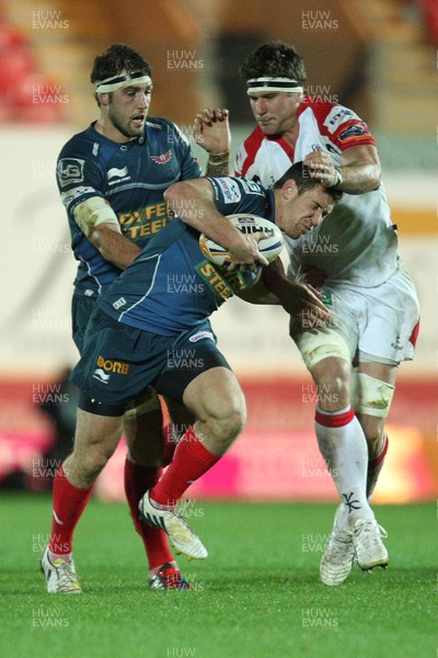 021113 - Scarlets v Ulster, RaboDirect PRO12 - Scarlets Adam Warren is tackled by Ulster's Robbie Diack