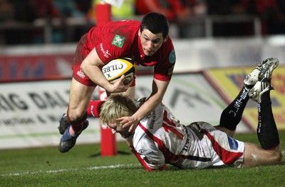 05.03.10 ... Scarlets v Ulster, Magners League -  Scarlets' Dan Newton is tackled by Ulster's Jamie Smith  