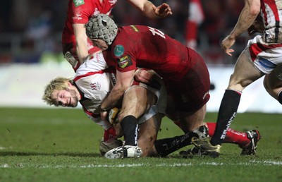 05.03.10 ... Scarlets v Ulster, Magners League -  Ulster's Jamie Smith is tackled by Scarlets' Jonathan Davies  