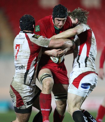 05.03.10 ... Scarlets v Ulster, Magners League -  Scarlets' Andy Fenby takes on Ulster's David Pollock and Andrew Trimble  