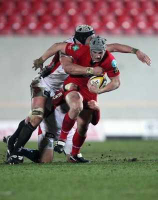 05.03.10 ... Scarlets v Ulster, Magners League -  Scarlets' Jonathan Davies takes on Ulster's Dan Tuohy and BJ Botha  