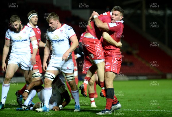 071218 - Scarlets v Ulster - European Rugby Champions Cup - Steff Evans of Scarlets celebrates his try with Kieron Fonotia (right)