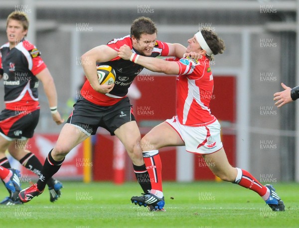 16.05.09 - Magners League Rugby -  Llanelli Scarlets v Ulster Ulster's Darren Cave is tackled by Scarlets' Martin Roberts 