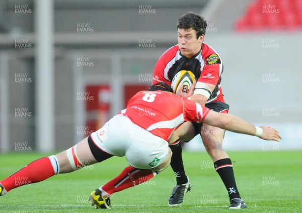 16.05.09 - Magners League Rugby -  Llanelli Scarlets v Ulster Ulster's Ian Whitten is tackled by Scarlets' David Lyons 