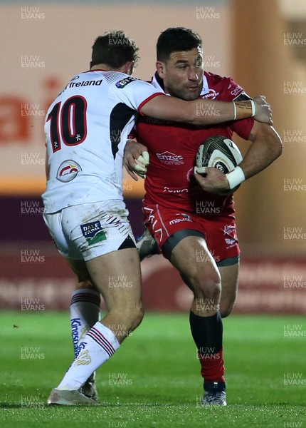 231118 - Scarlets v Ulster - Guinness PRO14 - Kieron Fonotia of Scarlets is tackled by Billy Burns of Ulster