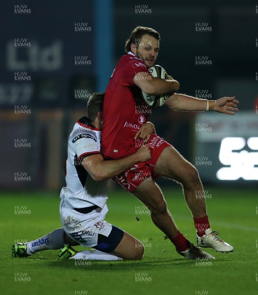 231118 - Scarlets v Ulster - Guinness PRO14 - Paul Asquith of Scarlets is tackled by Louis Ludik of Ulster
