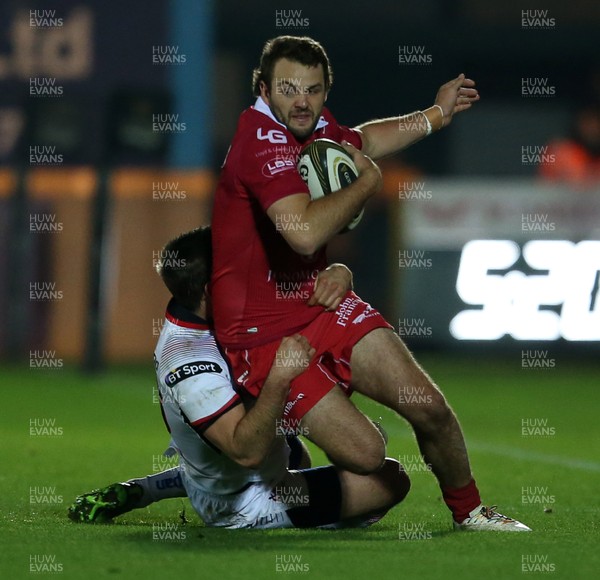 231118 - Scarlets v Ulster - Guinness PRO14 - Paul Asquith of Scarlets is tackled by Louis Ludik of Ulster