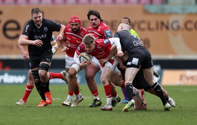 240126 - Scarlets v Ulster - United Rugby Championship - Archie Hughes of Scarlets is tackled by Nathan Doak of Ulster 